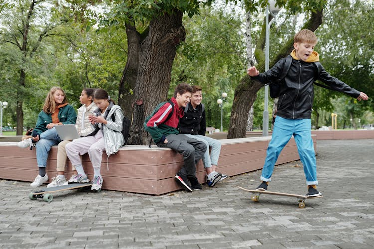 A Young Boy Riding A Skateboard