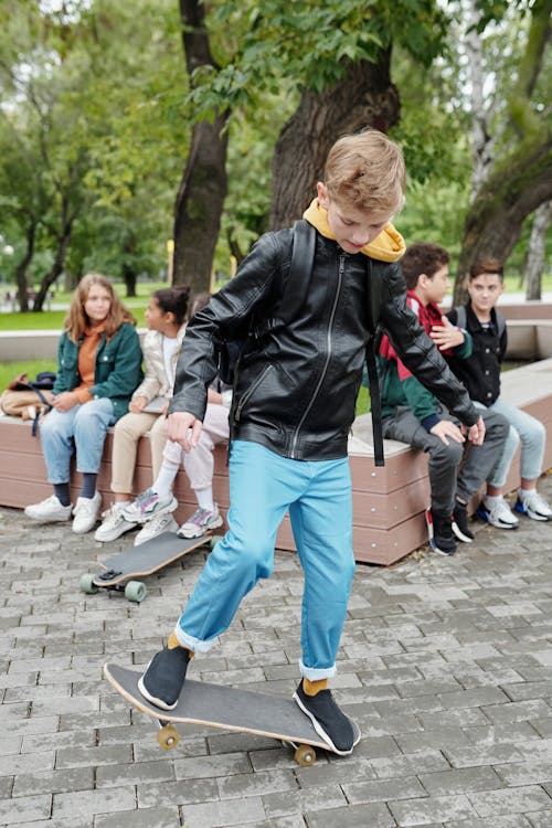 A Boy Using Skateboard