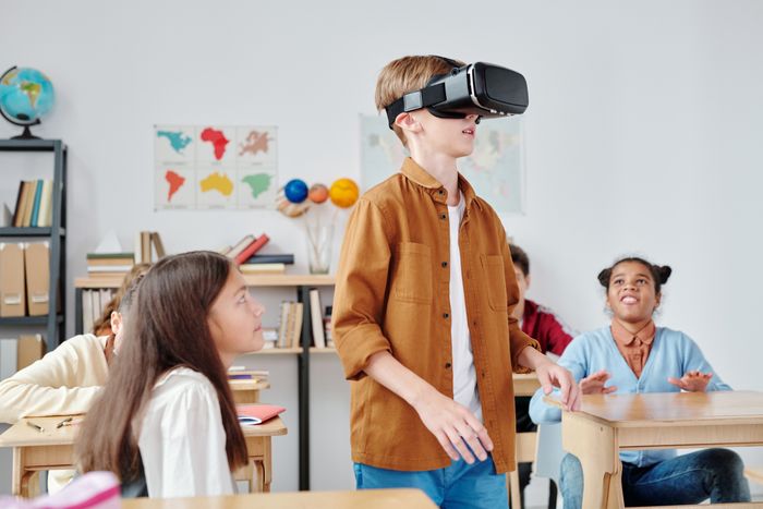 Student trying a VR headset in class
