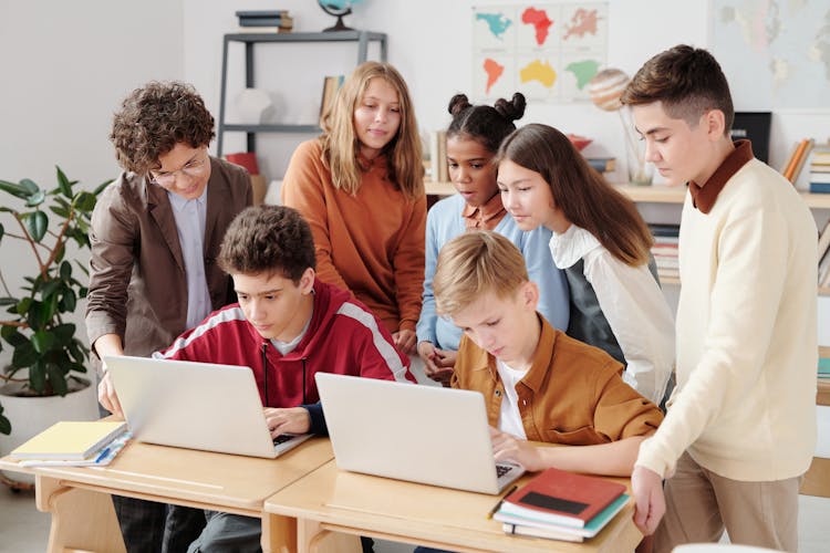 A Children Looking The Laptop