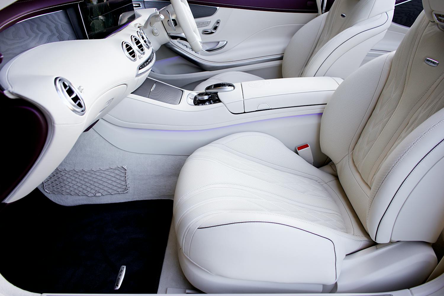 Luxury car interior with white leather