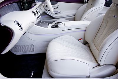 White leather seat cover stitching detail