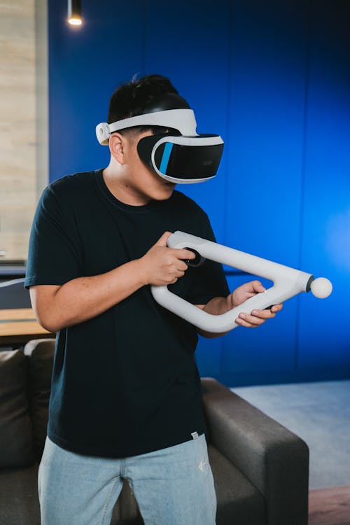 Free A Man Playing Using Virtual Reality Gun Stock Photo