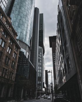 View of Frankfurt's modern skyscrapers under a cloudy sky, showcasing urban architecture.