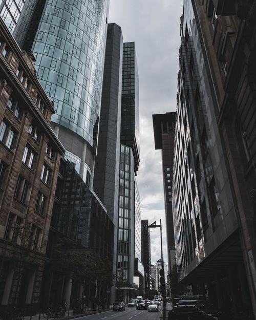 Free View of Frankfurt's modern skyscrapers under a cloudy sky, showcasing urban architecture. Stock Photo