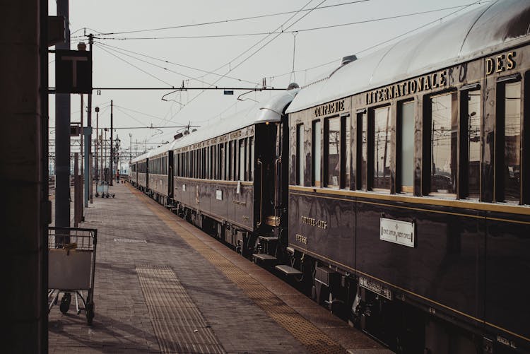 Old Fashioned Train Parked On Railroad Station