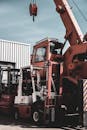 Forklift and Crane in an Industrial Area