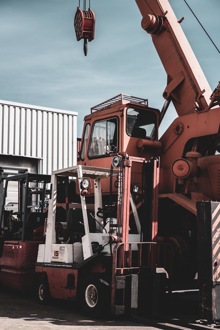 Forklift And Crane In An Industrial Area