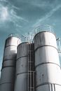 Gray Steel Barrels Under Blue Sky