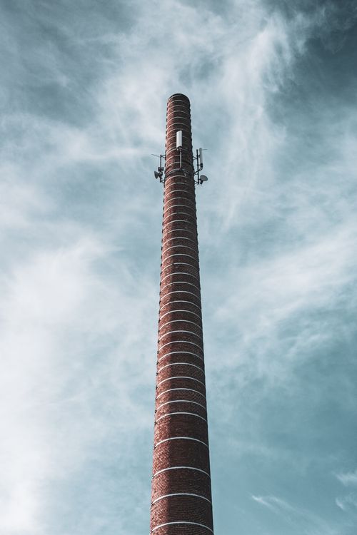 High Chimney Tower against Blue Sky · Free Stock Photo