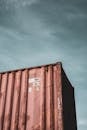 Brown Steel Cargo Container Under Blue Sky