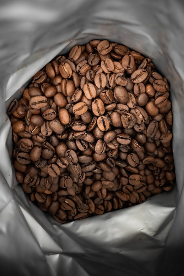 Brown Coffee Beans In Silver Package