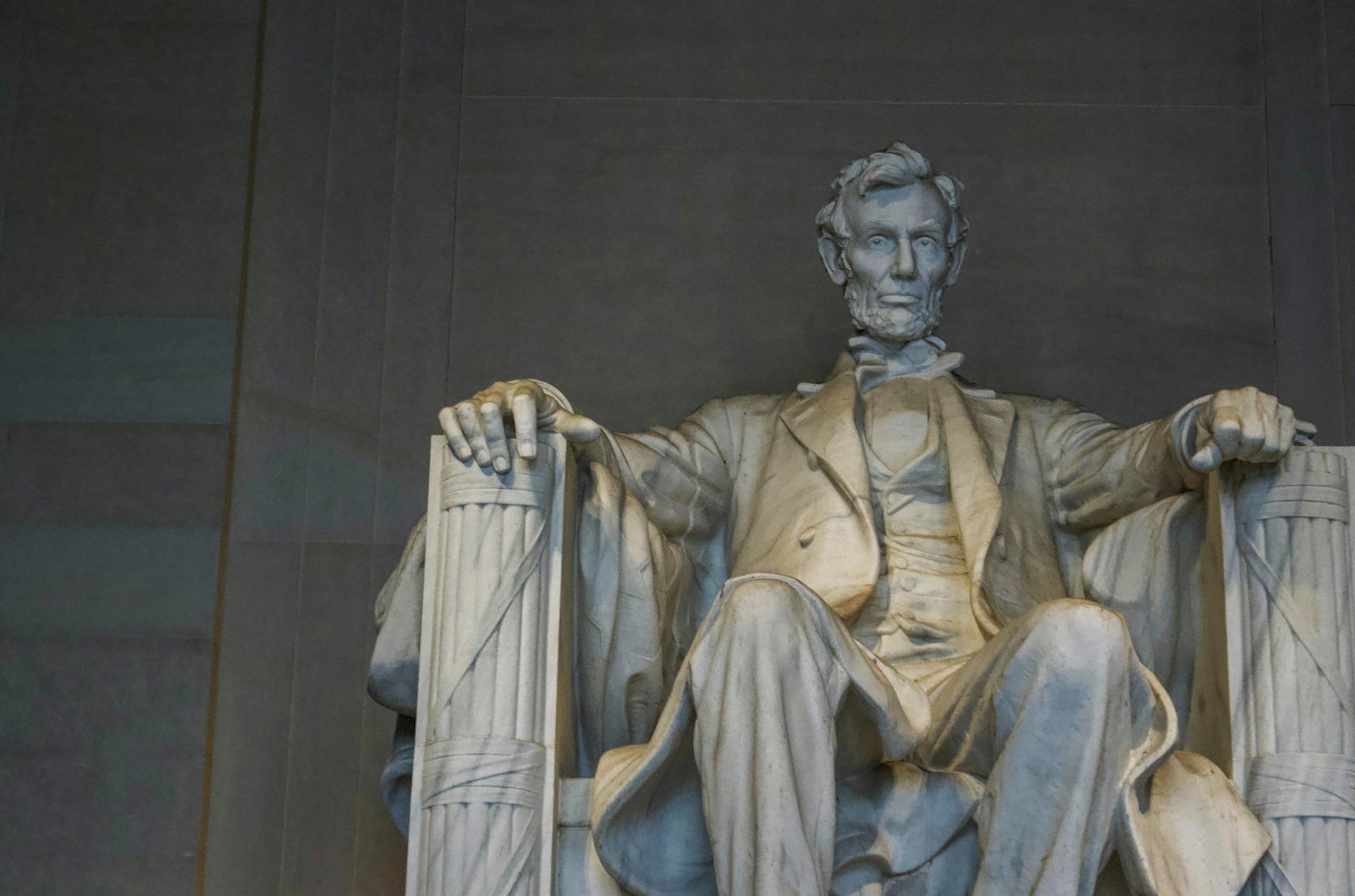 Aged marble statue of president in memorial