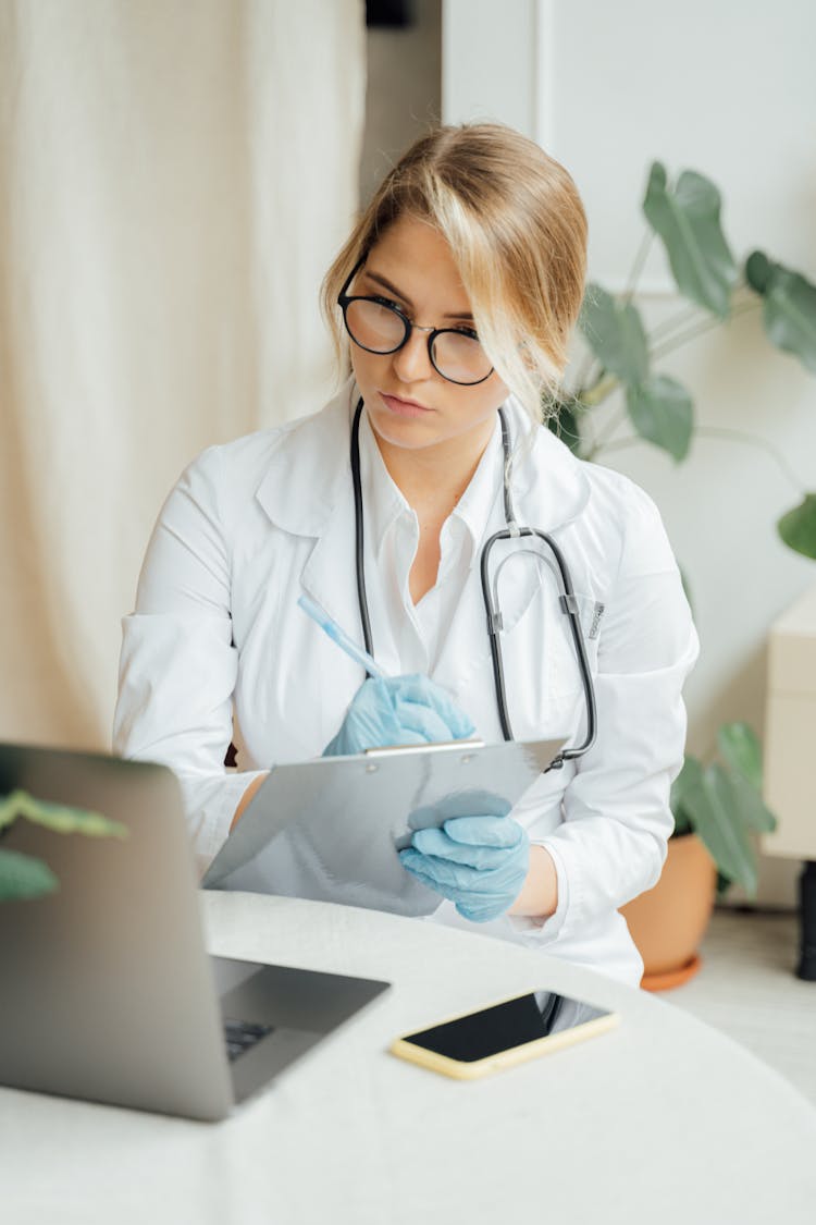 Female Doctor Taking Notes