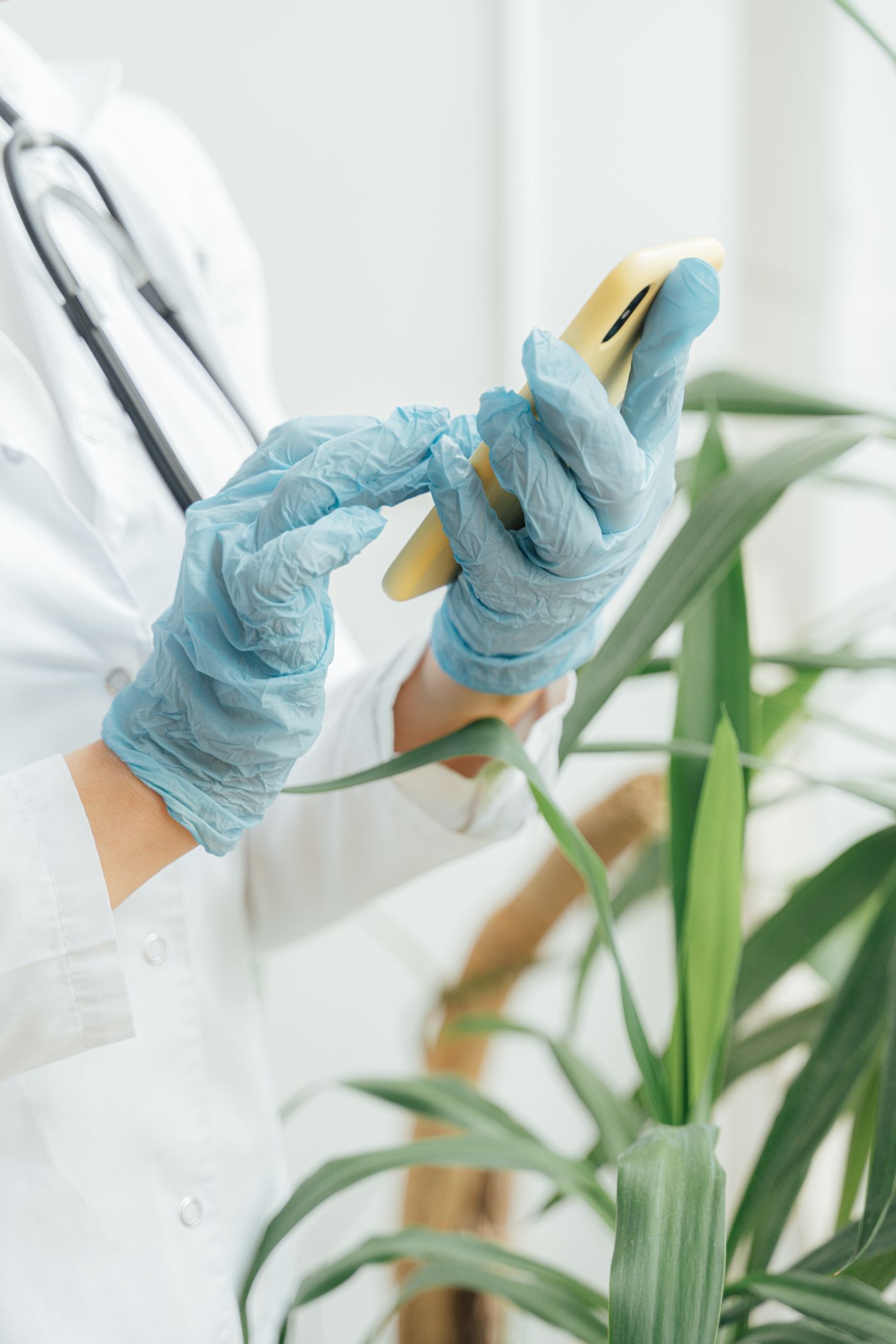 Doctor using a smartphone for digital patient communication