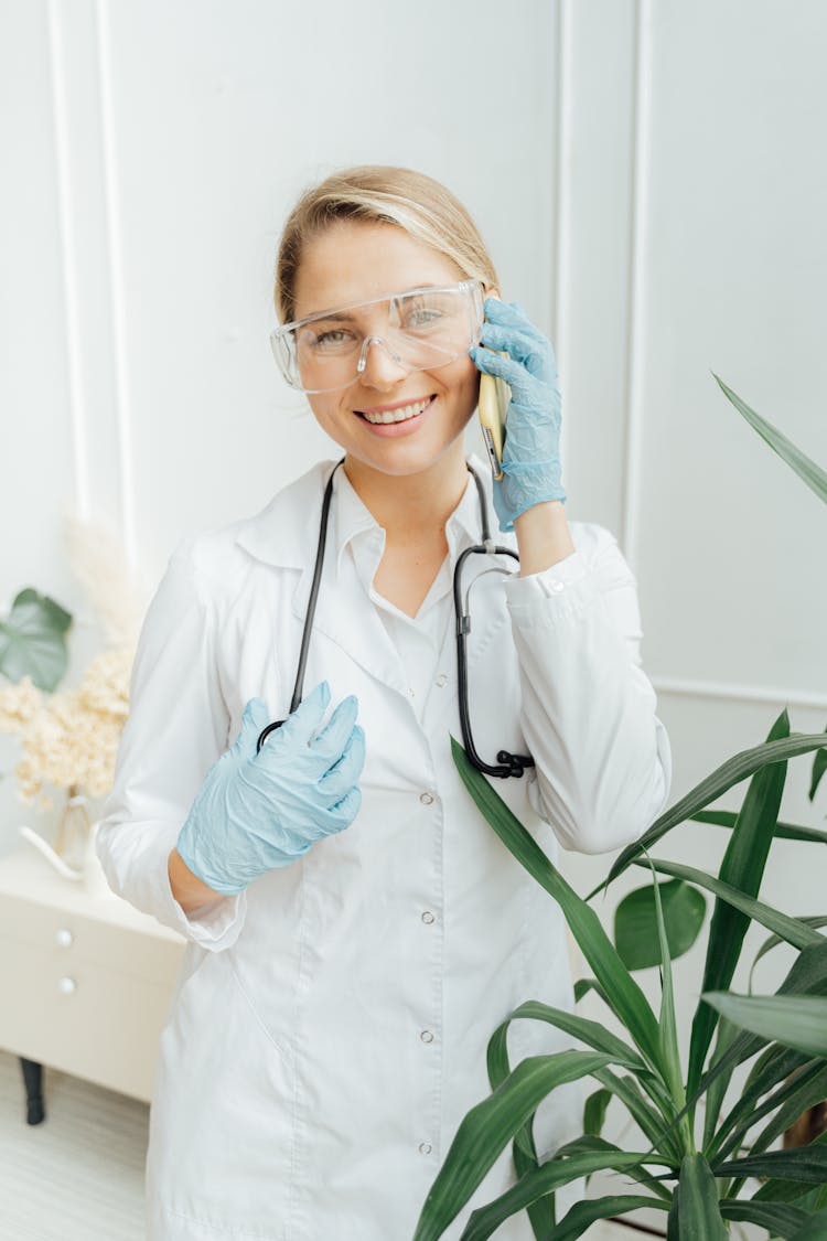 A Female Doctor In PPE Smiling