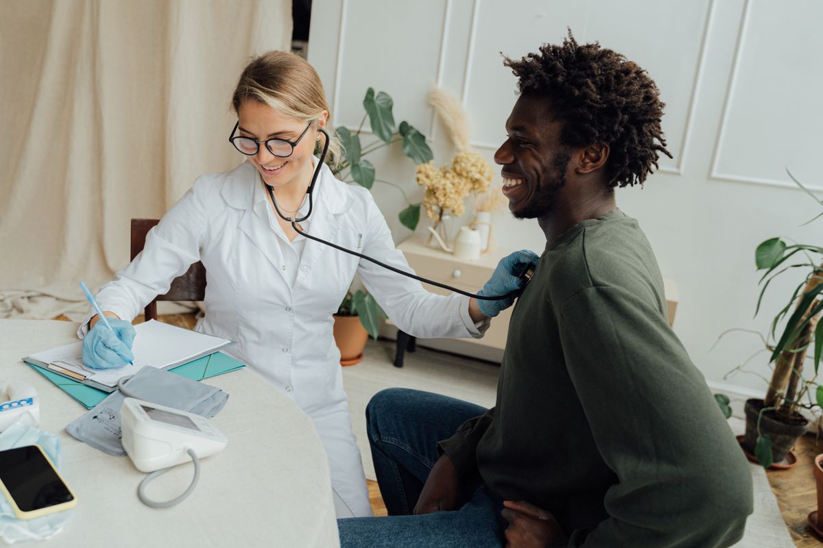 Doctor examining a male patient during a clinical checkup
