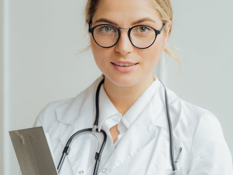 Doctor consulting with happy patient