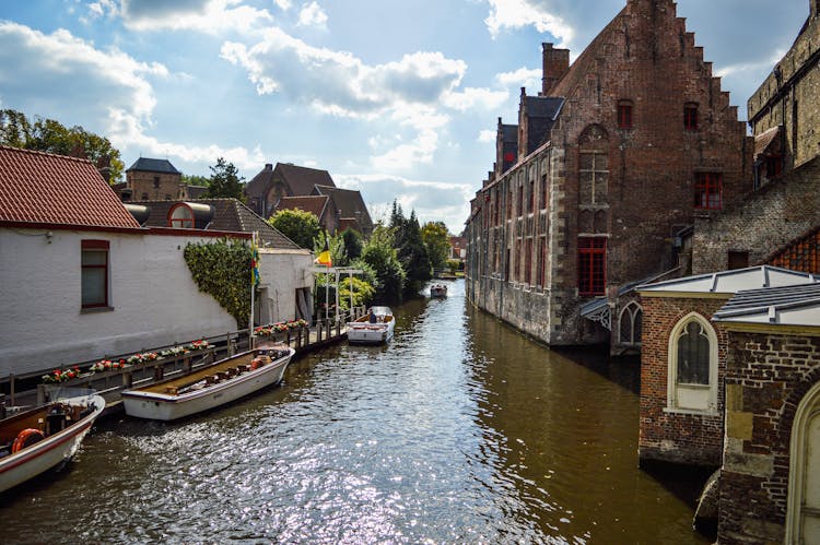 Historical Brick Ancient Buildings In Town On Water