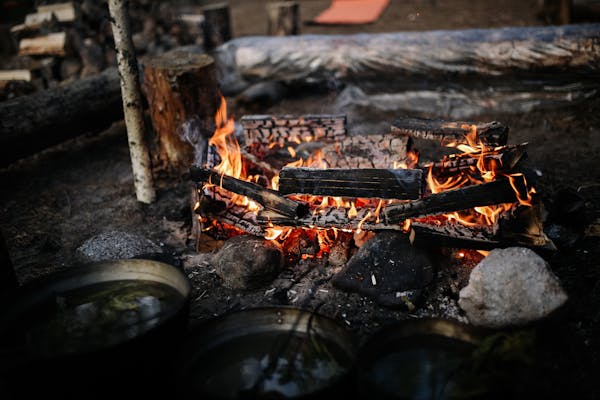 Marshmallow roasting sticks by a campfire