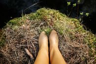 Persons Feet on Brown Dried Grass