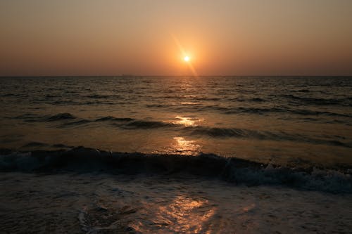 Sunset over Wavy Sea