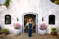 Woman in Blue Dress Standing in Front of Mirror