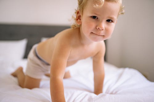 Free Boy on Bed Stock Photo