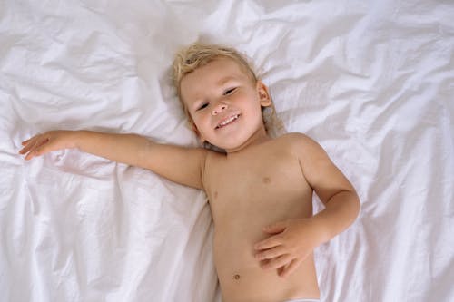 Child Lying on Bed