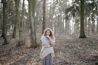 Young Woman Posing in Autumn Forest