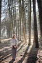 Woman on a Walk in the Woods on a Sunny Day