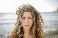 Portrait of a Woman with Curly Hair