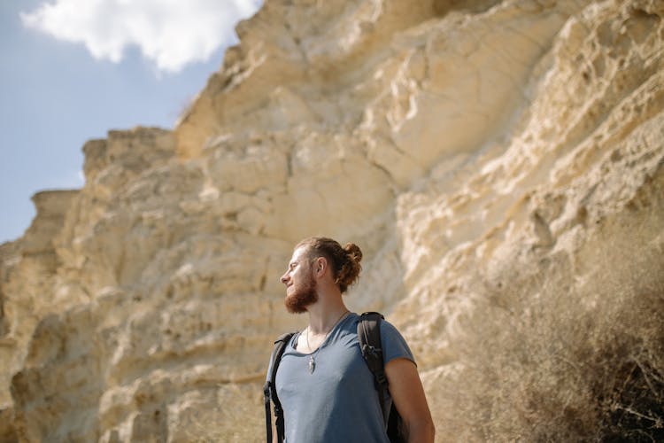 A Bearded Man Carrying A Backpack