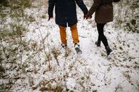Back View of Couple in Outerwear Walking on Winter Ground