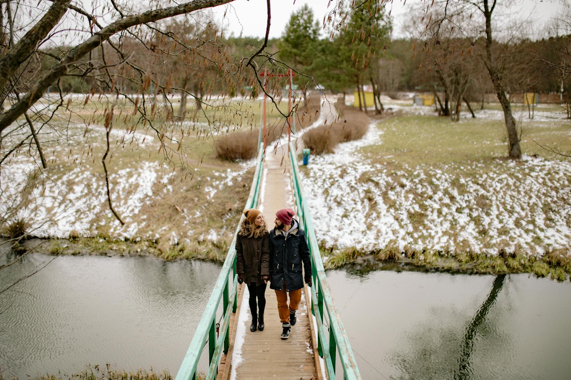 A Couple on a Bridge Standing Side by Side