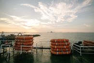 Orange Plastic Chairs on Dock