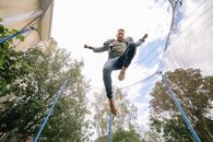 Cloudy Sky above a Man Jumping on a Trampoline