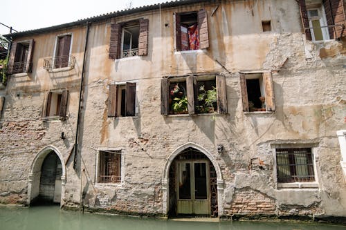 Windows and Doors on a Building at a Flooded Street