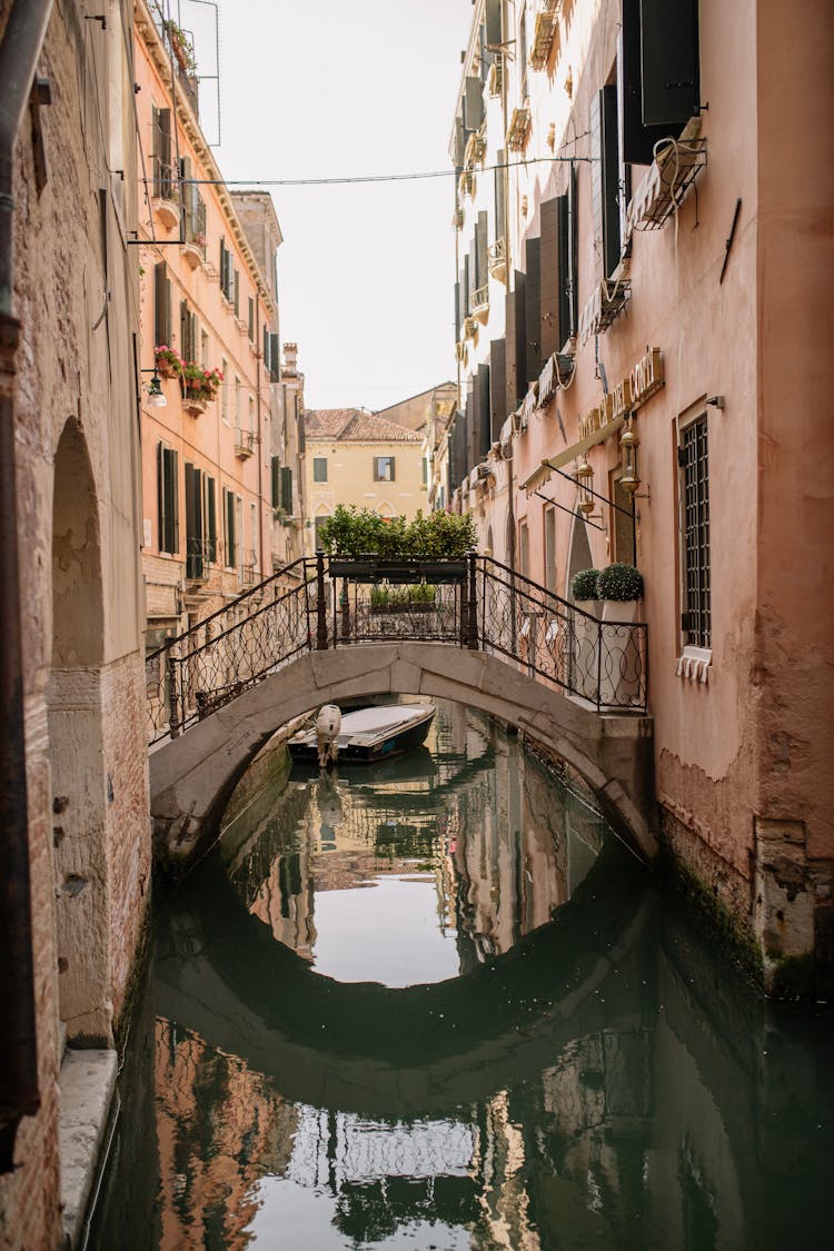 Narrow Canal With Bridge