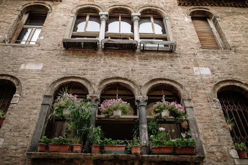 Low Angle View of a Building Facade with Bricks and Arches