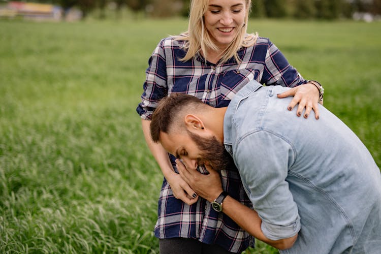 Happy Man Hugging Woman Pregnant Belly