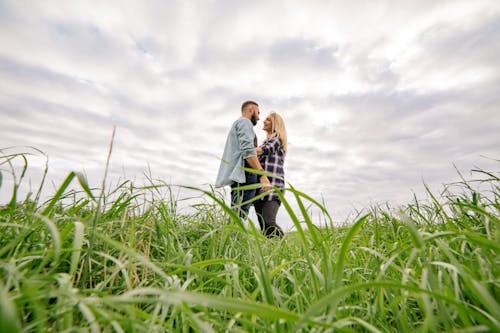 Happy Couple Hugging on a Field 