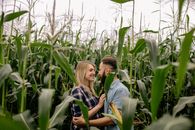 2 Women Sitting on Corn Field