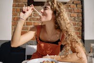 Woman Eating and Enjoying Her Food 