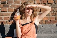 Woman Having a Drink on a Hot Day 