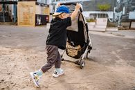 Boy Pulling Stroller