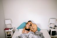 Topless Man Lying on Bed