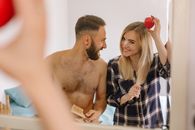Man and Woman Sitting on Bed
