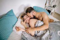 Topless Man Lying on Bed