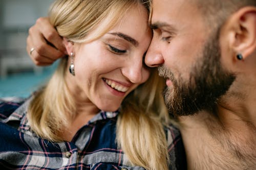 Free Man and Woman Smiling While Kissing Stock Photo